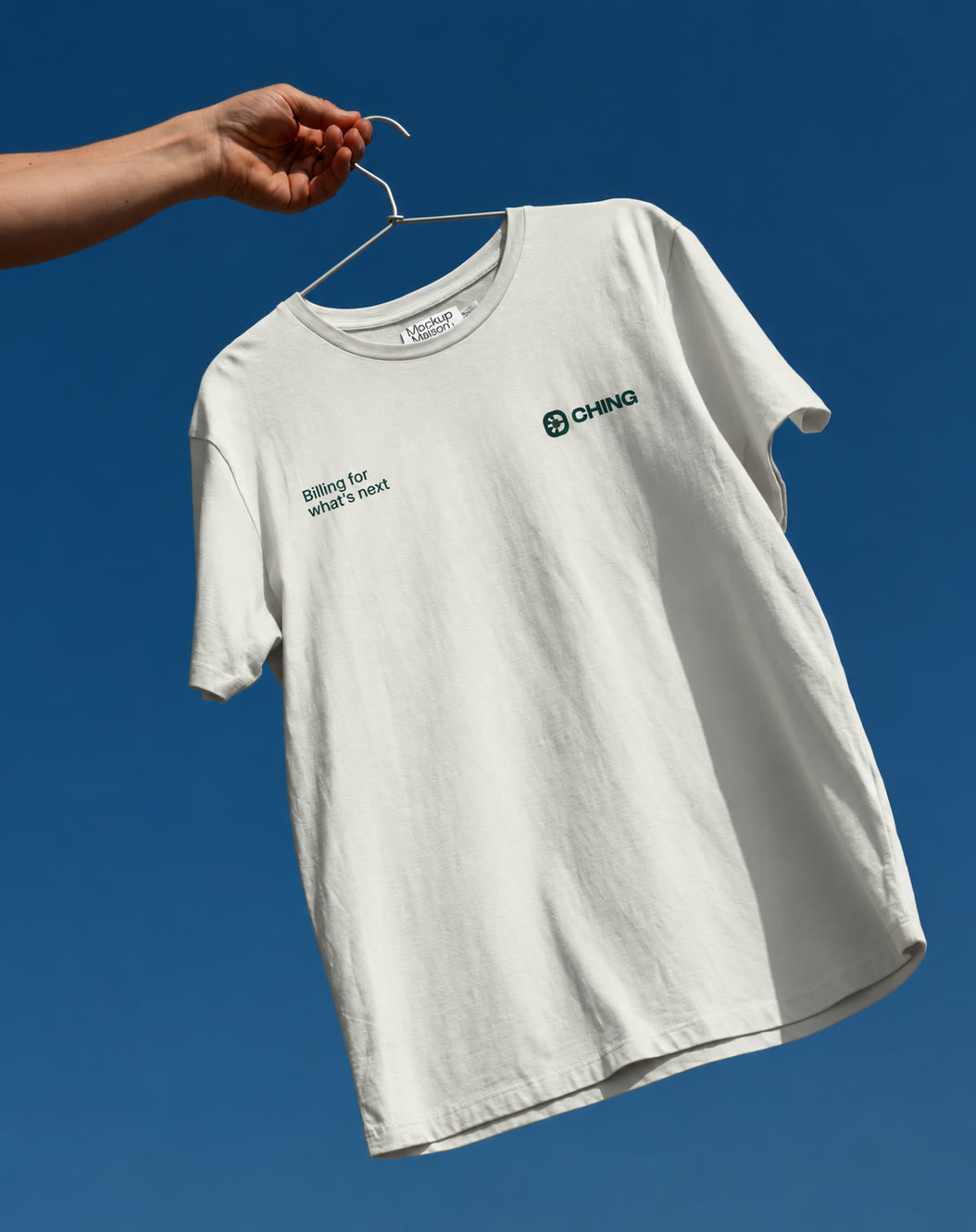 CHING t-shirt on a hanger against a blue sky